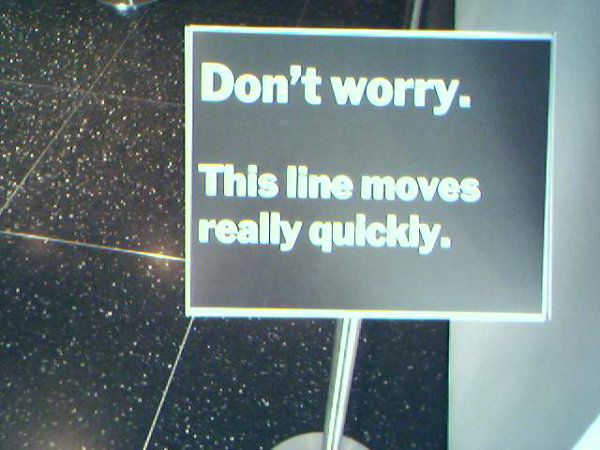 Street sign that says: Don't worry. This line moves really quickly